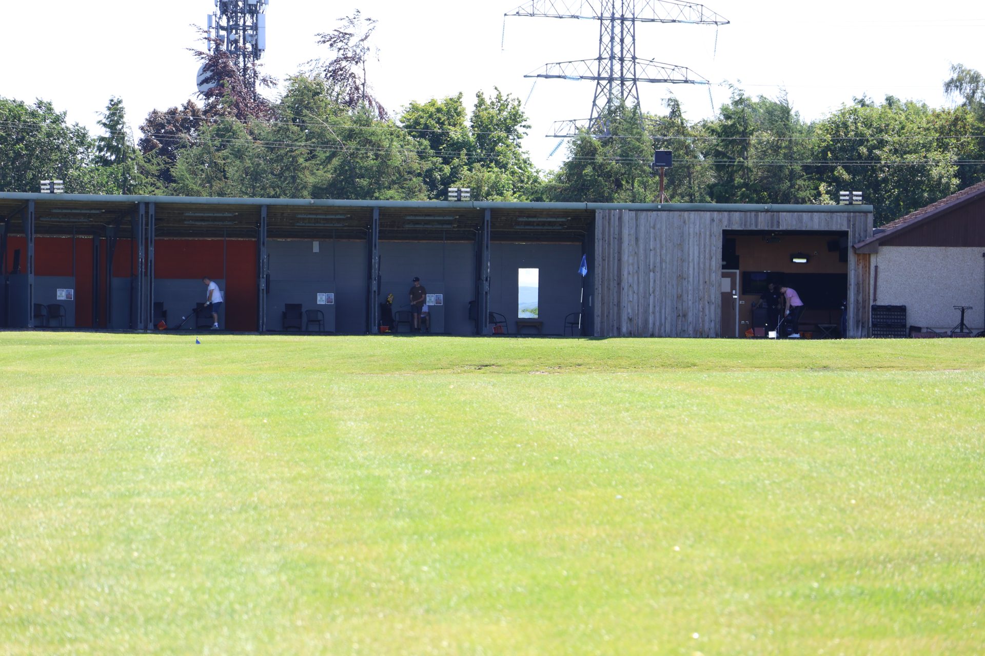 The covered range bays seen from the outfield