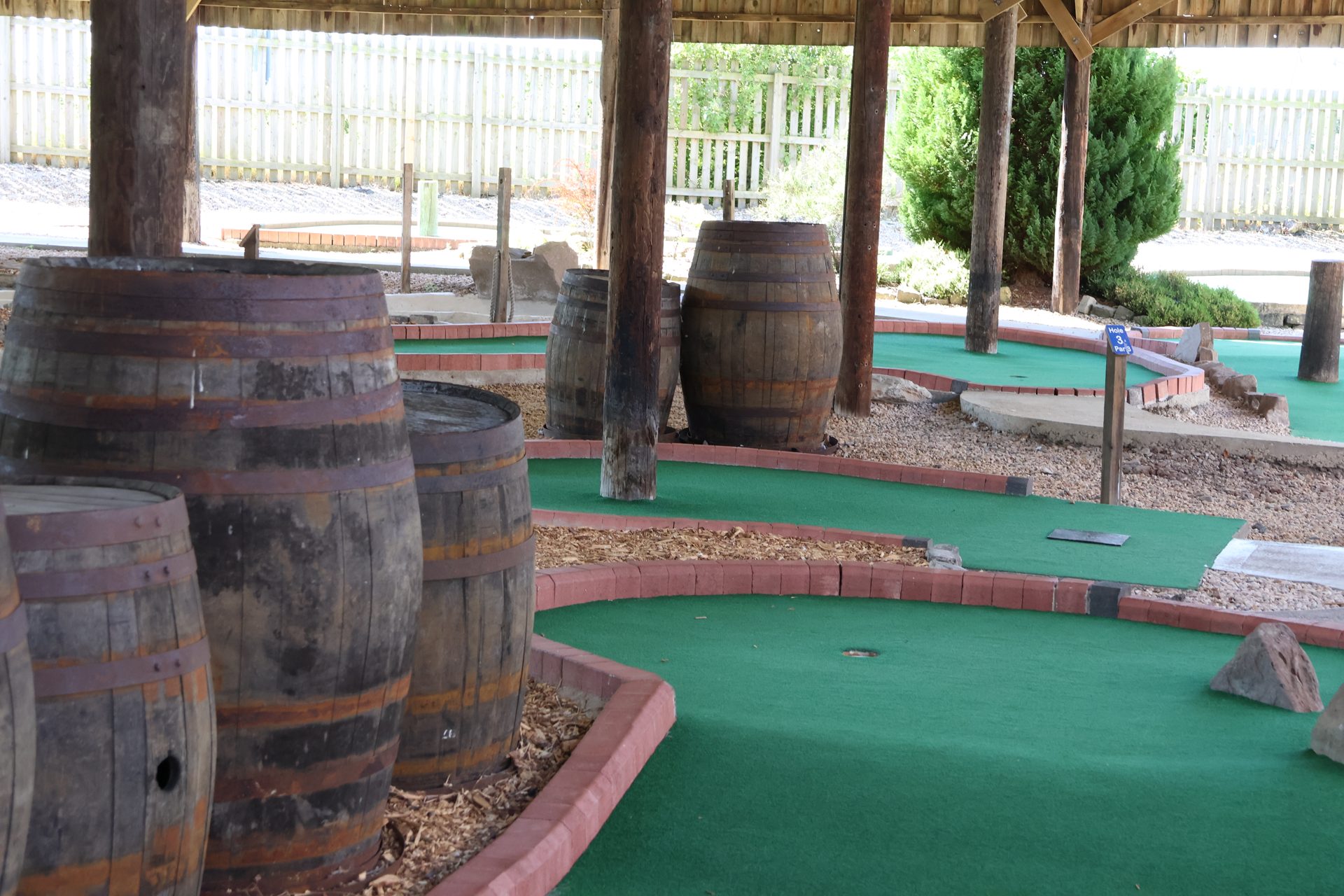 Covered holes lined with old wooden barrels